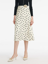 a lady in a silk polka dots printed midi skirt